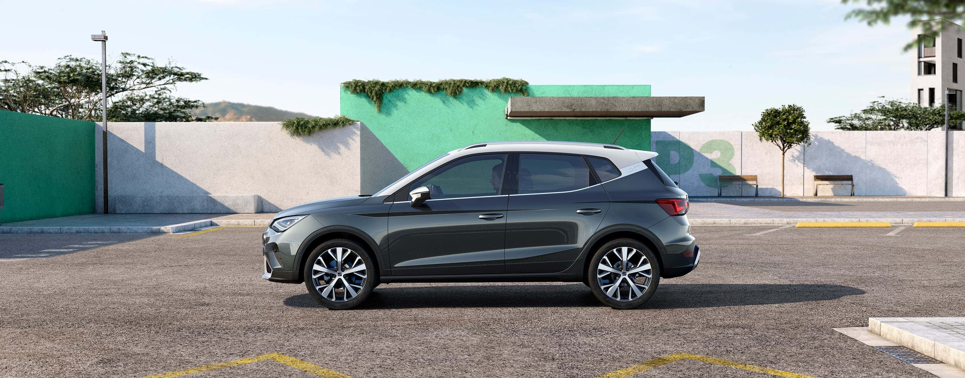 Rear view of the SEAT Arona dark camouflage colour with candy white roof