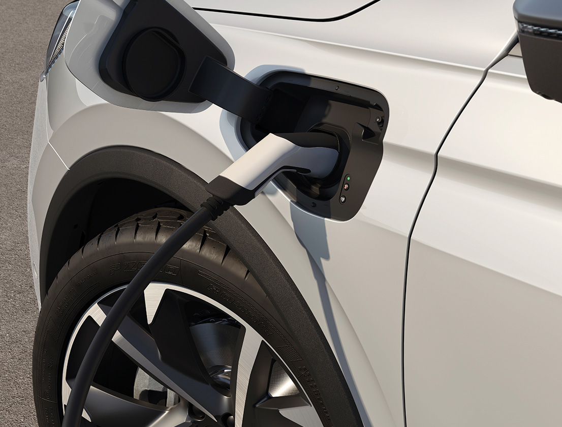 The SEAT Tarraco car charging in white